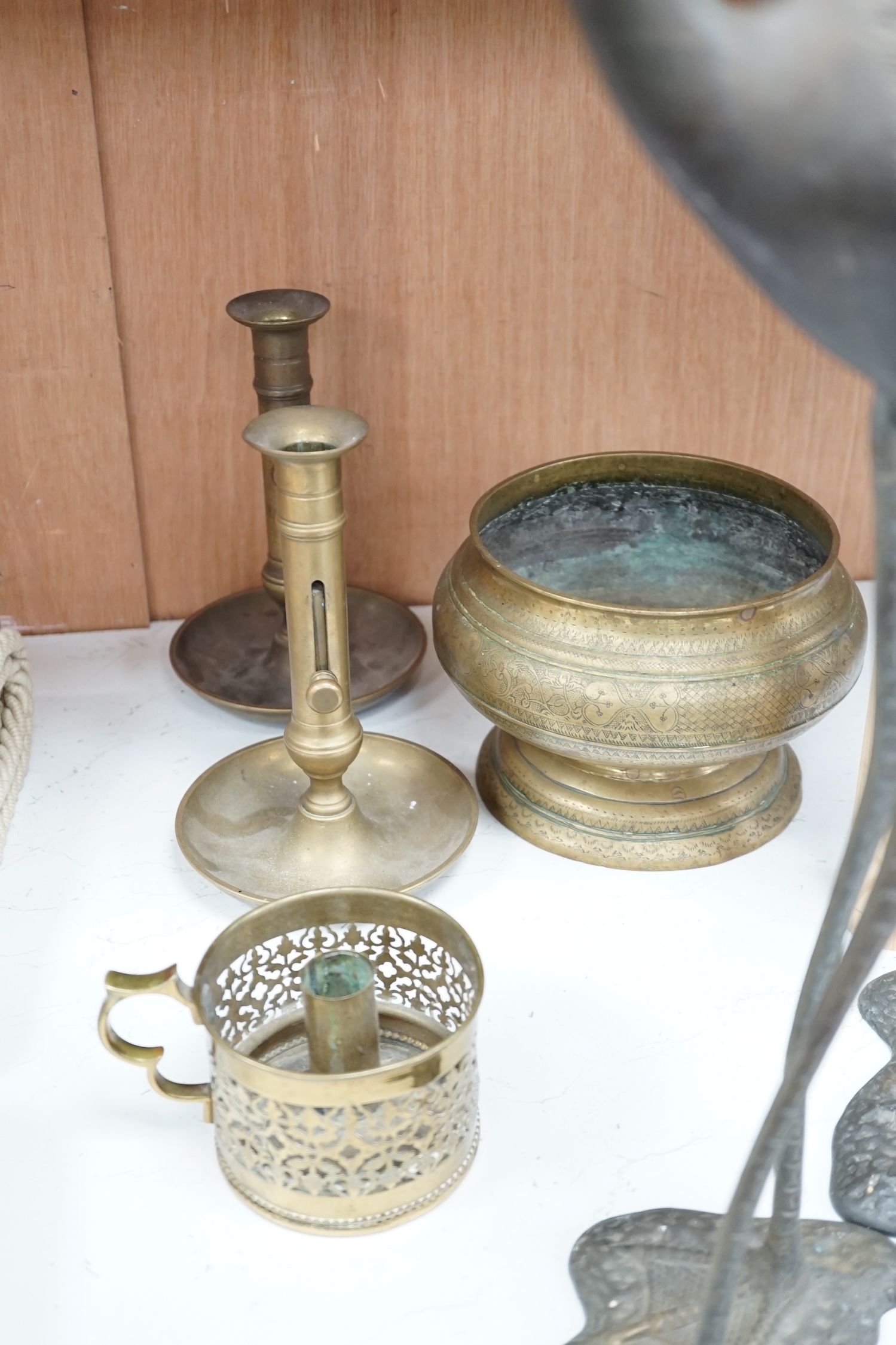 A pair of brass cranes, a pair of brass chamber sticks another chamberstick and a bowl, tallest 53cm high